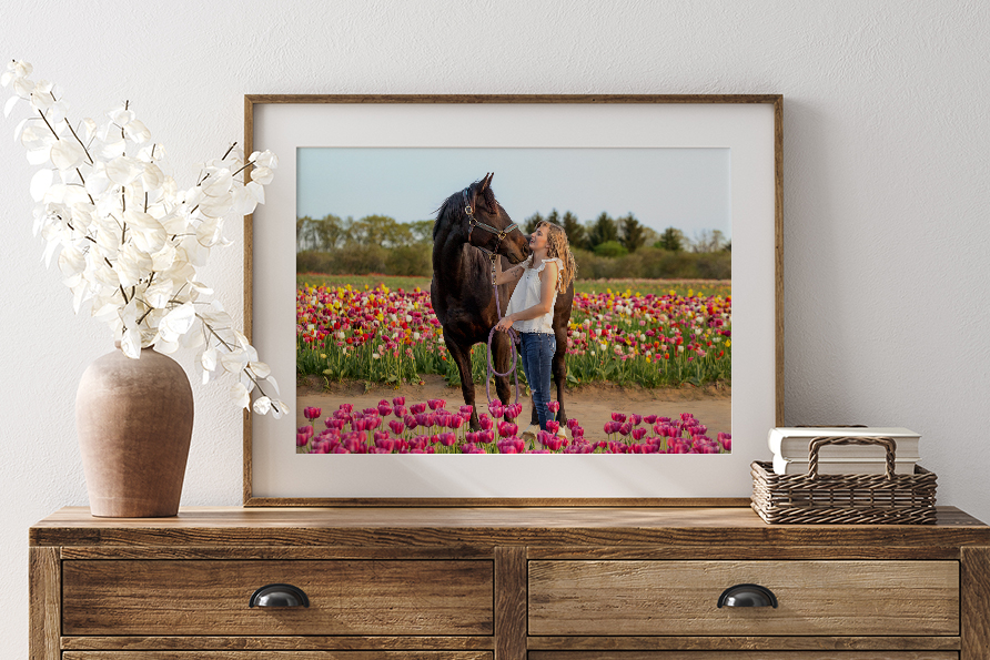 framed print of girl and her horse in tulips