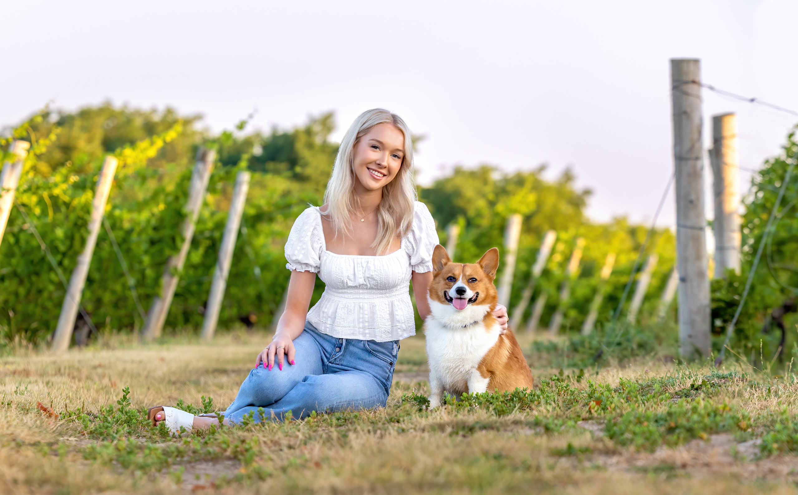 girl and corgi in vineyard at Malivoire Wine in Beamsville at dawn