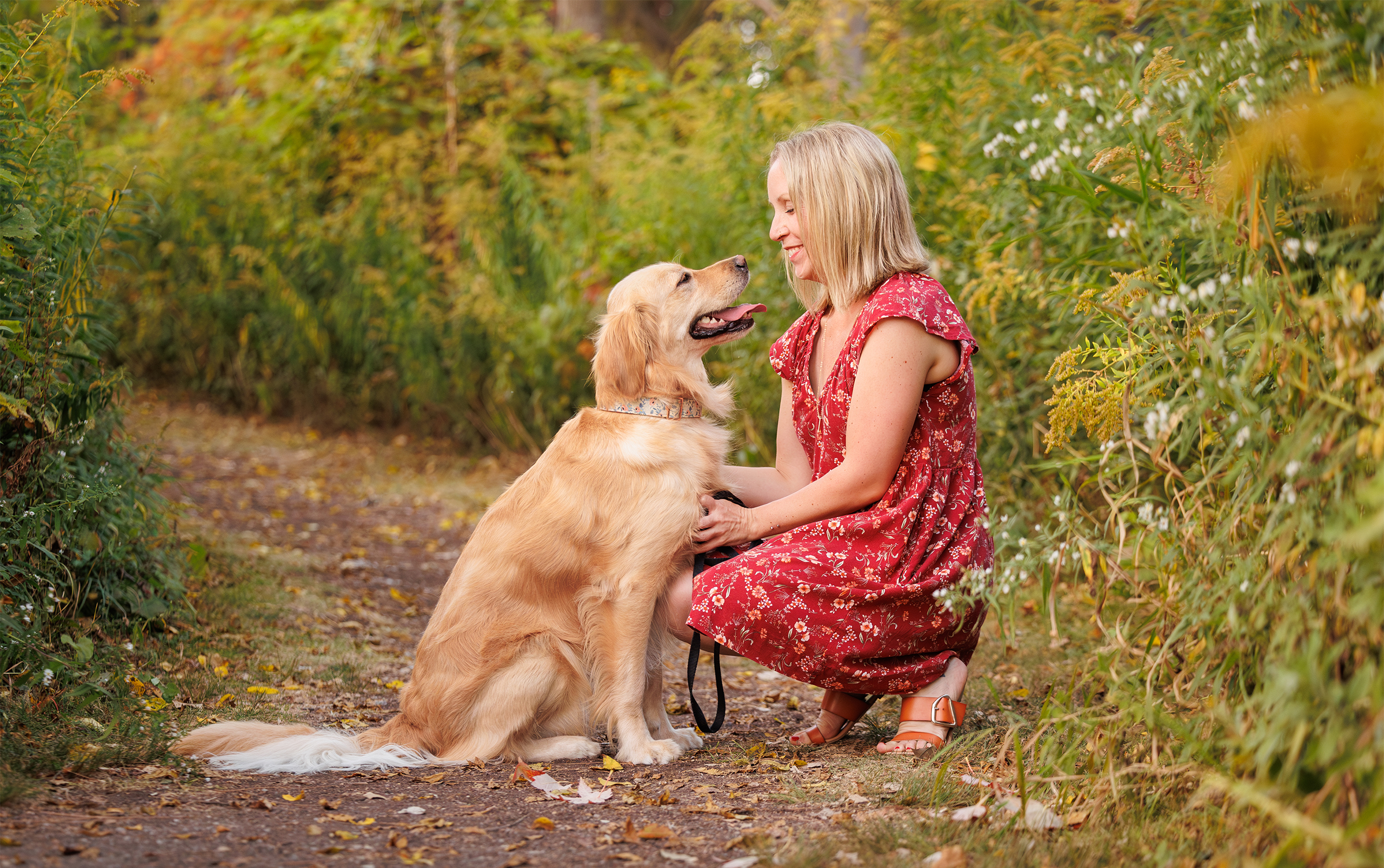 woman and her dog on a trail